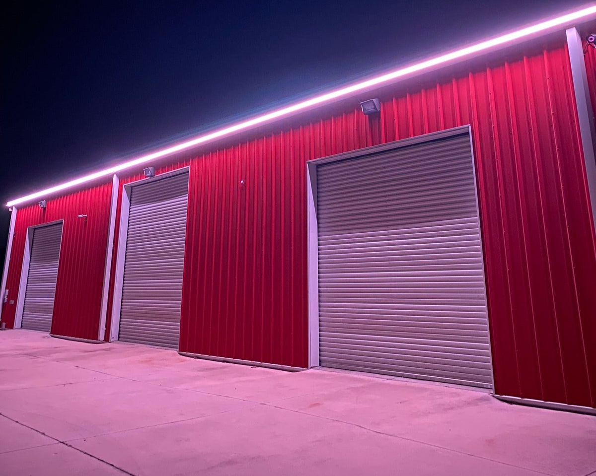 Central Florida commercial building illuminated with professional exterior architectural roofline lighting