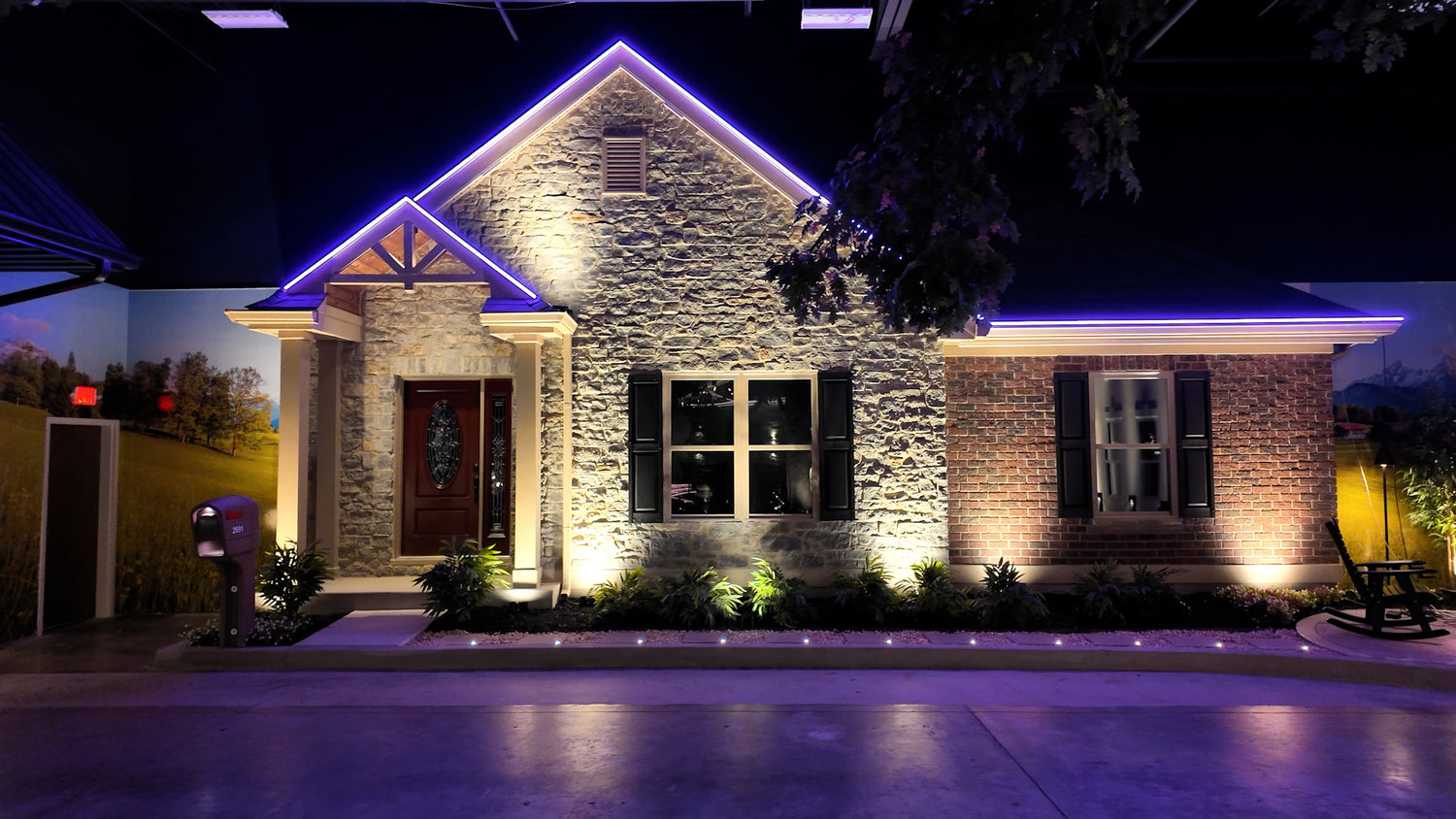 Permanent holiday lighting system installed along residential roofline with color changing LEDs