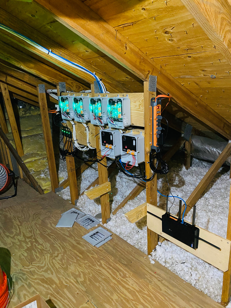 Permanent outdoor lighting control system and wiring installed neatly in an attic space