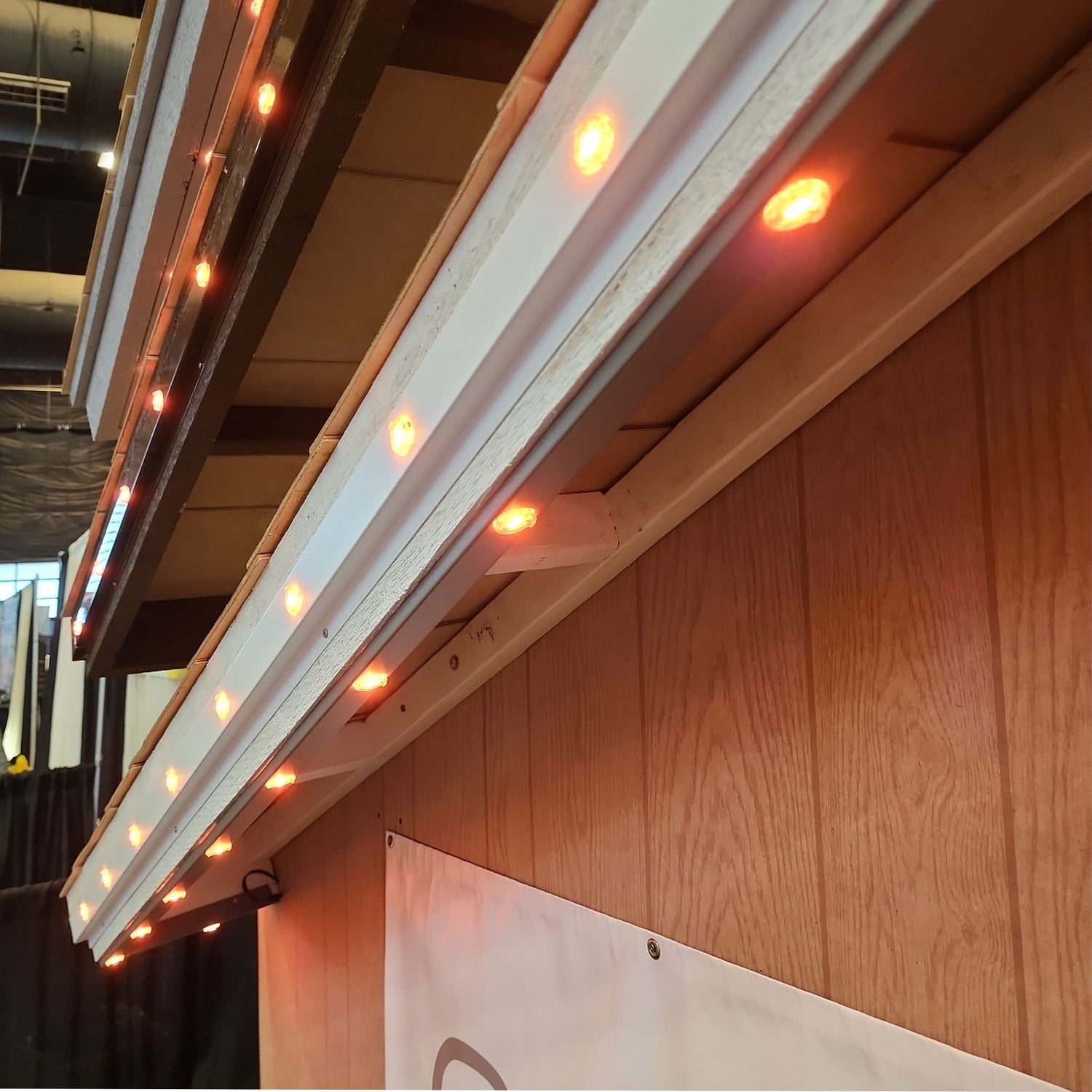 Close-up of permanent roofline lighting track and LED lights installed along residential roofline