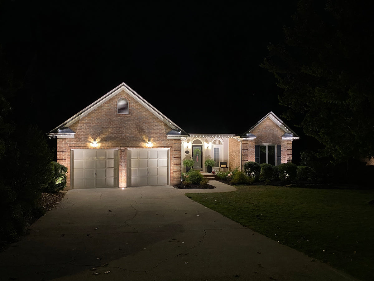 Residential outdoor lighting illuminating a front yard and home exterior in The Villages Florida for improved curb appeal and visibility